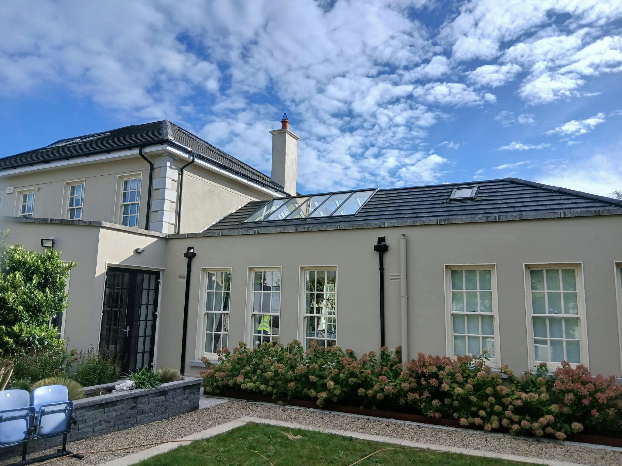 Completed replacement double glazing in the roof section, viewed from the garden